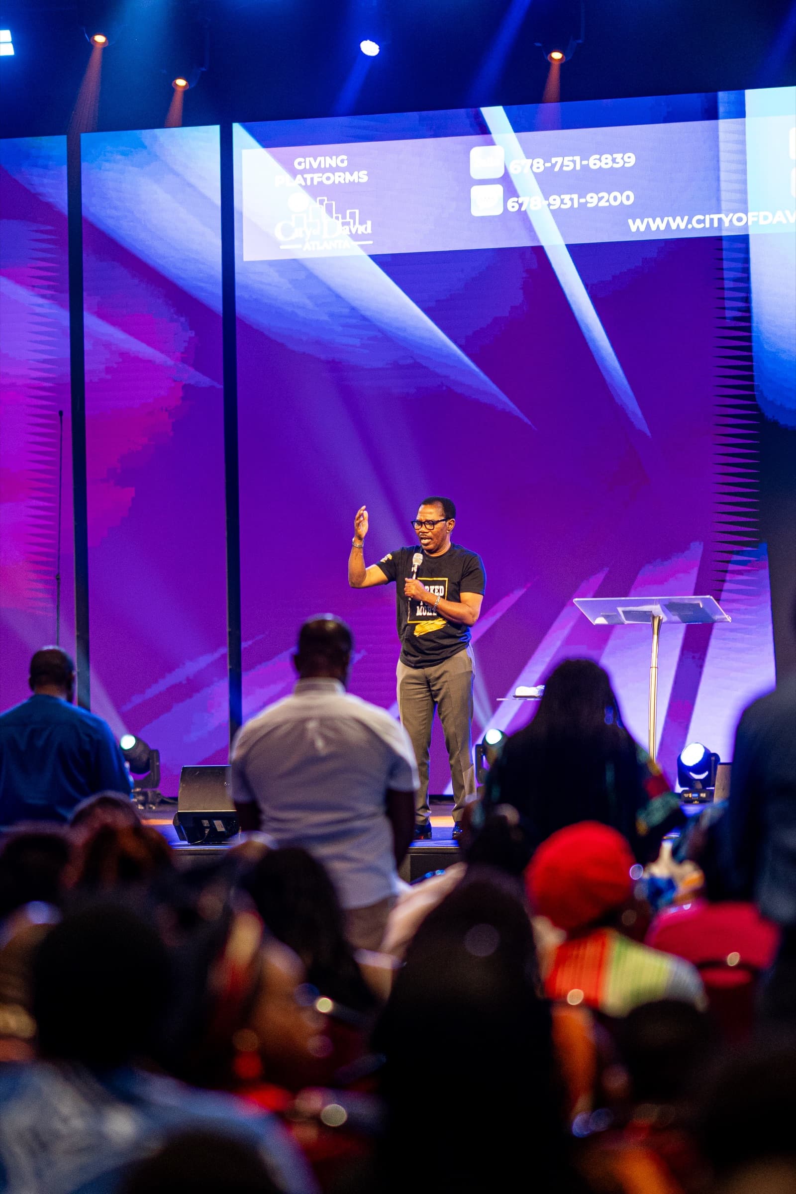 Pastor ministering on stage at City of David Atlanta